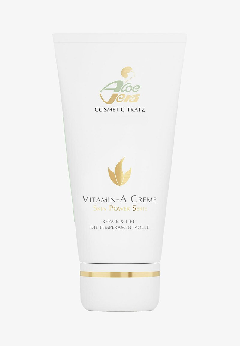 White tube container with a gold accent band, featuring green and gold text. Label reads "Vitamin-A Creme Skin Power Serie."