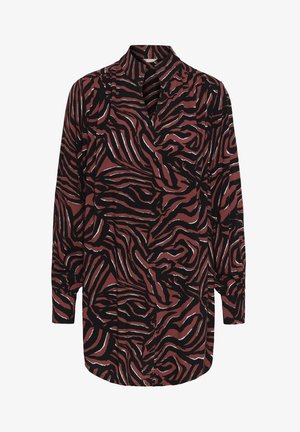 Blusa a maniche lunghe in stampa zebra nera, bordeaux e bianca. Presenta un collo a spacco, tessuto morbido e una vestibilità rilassata.