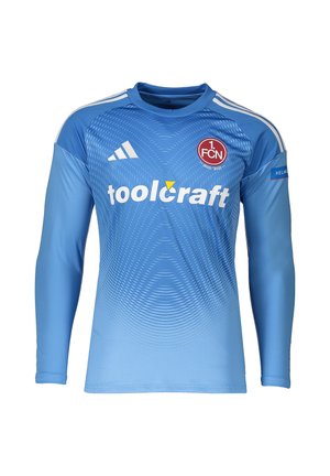 Maillot de football bleu à manches longues avec logo Adidas blanc, écusson du club 1. FCN, logo du sponsor Toolcraft et bandes blanches aux épaules.