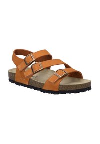 Sandali in pelle tan con tre cinturini regolabili, suola intermedia in sughero, plantare testurizzato e suola esterna in gomma nera. Fibbia in tonalità argento che accentua i cinturini.
