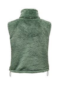 Rohelise fleece'iga vest kõrge kaelusega. Pehme, kohev tekstuur, ilma kinnitusteta, reguleeritav alumine serv paeladega, varrukateta disain.