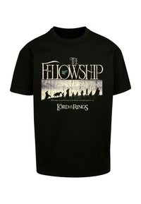 T-shirt en coton noir avec un design graphique contenant le texte "La Confrérie" et des silhouettes, en rapport avec la série "Le Seigneur des Anneaux".