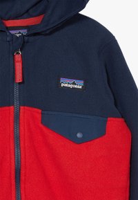 Patagonia BABY SNAP UNISEX - Casaco polar - fire/new navy