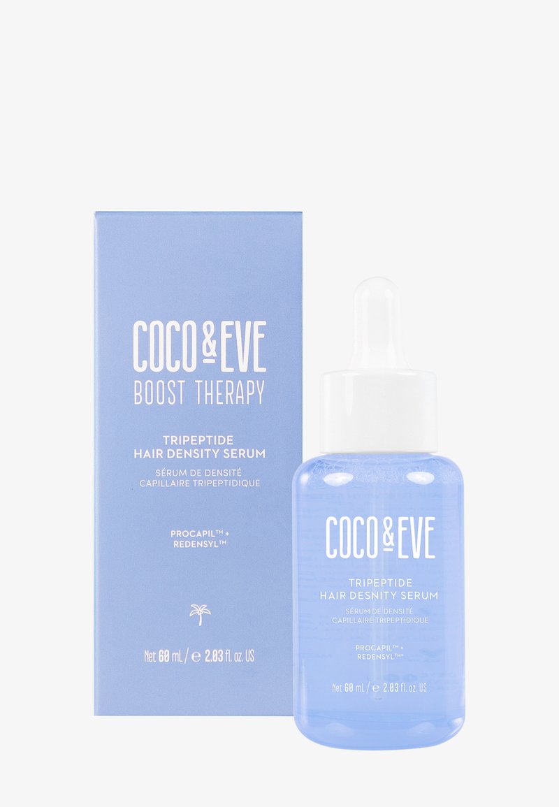 Siero per la densità dei capelli Coco & Eve in una bottiglia trasparente e rotonda con un contagocce bianco. La confezione è di un blu chiaro con testo bianco che dettaglia il nome del prodotto e il contenuto.