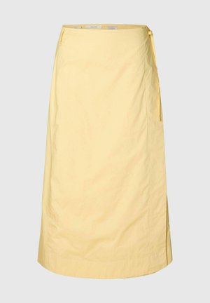 Jupe portefeuille jaune clair avec fermeture à nouer sur le côté, longueur au genou, tissu lisse et forme légèrement évasée en A.