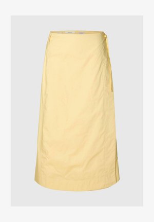 Világossárga átkötős szoknya oldalt megkötős zárral, térdig érő, sima anyagból, enyhén A-vonalú szabással.