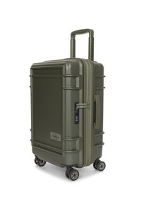 Valise rigide verte avec surface texturée, double zip, serrure à combinaison, poignée rétractable et quatre roues pour la mobilité.