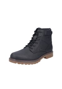 Botas de tobillo de cuero negro con un acabado texturizado, punta redonda, seis ojales metálicos y una suela de goma marrón con un patrón antideslizante.