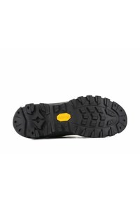 Czarna podeszwa buta trekkingowego z głębokim wzorem bieżnika, logo Vibram w kolorze żółtym oraz wytrzymałą teksturą zaprojektowaną do zapewnienia przyczepności na różnych nawierzchniach.