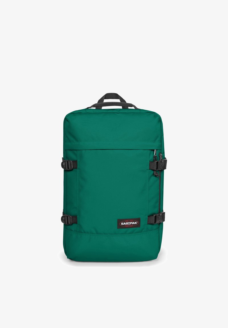 Sac à dos en tissu vert de forme rectangulaire, avec une poche zippée à l'avant, des bretelles réglables et le logo Eastpak en bas à l'avant.