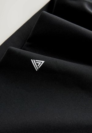 Black fabric with a smooth texture, featuring a silver logo with a triangular design in the lower corner. The fabric is folded.