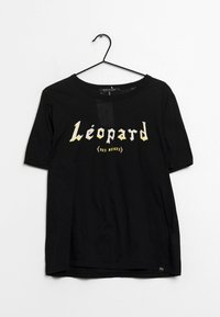 Camiseta de algodón negra con mangas cortas y cuello redondo, con el texto "Léopard des neiges" en letras estilizadas y multicolores.