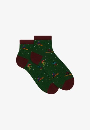 Green socks with a maroon cuff and toe, featuring colorful snowboarding figures and small white snowflakes throughout the design.