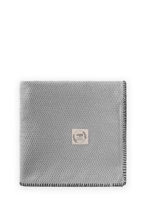 Folded gray blanket with subtle chevron pattern, black stitched edges, and a beige label reading "cigit BOHEME premium quality" in the center.