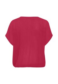 Haut ample à manches courtes de couleur rouge vif. Tissu texturé, forme rectangulaire et encolure arrondie. Semble léger et respirant.