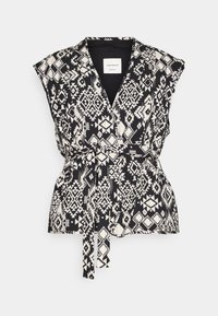 Svart och vit mönstrad omslagstopp med korta ärmar, V-hals och knytmidja. Har geometriska mönster och en len tygstruktur.