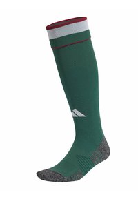 Calcetín verde hasta la rodilla con parte superior a rayas rojas y blancas. Cuenta con una plantilla texturizada gris con secciones de soporte acanaladas y un logo.