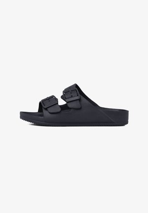 Sandalia negra abierta en la parte delantera con dos correas ajustables con hebilla y suela texturizada, diseñada para uso casual.