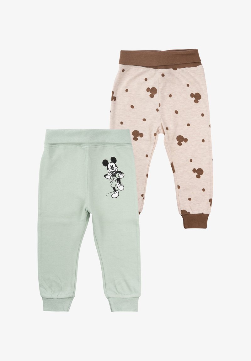 Zwei Paare Kinderhosen: eine mintgrüne mit einem Mickey-Maus-Graphic und eine beige mit braunen Punktmustern, beide mit elastischen Taillenbündchen.