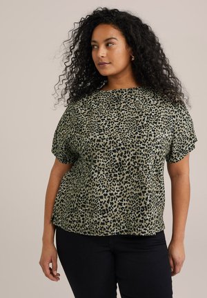 Green leopard print top with a loose fit, short sleeves, and a rounded neckline. Made from smooth fabric with a subtle sheen.