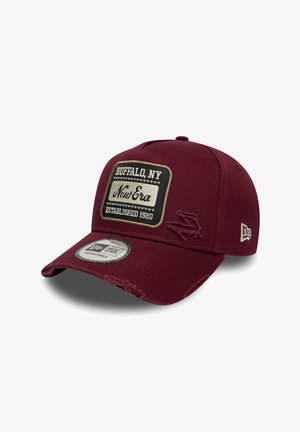 Maroon cap with adjustable strap, featuring a distressed fabric design, a rectangular patch reading "Buffalo, NY," and New Era branding.
