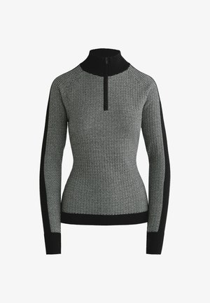 Pull en noir et blanc à motifs avec un col haut, fermeture éclair à l'avant, et accents noirs sur les manches et les poignets, fabriqué en tissu tricoté texturé.