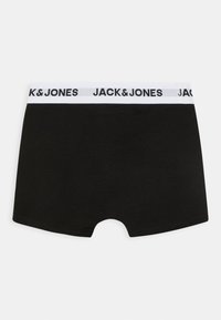 Boxer shorts noirs avec une ceinture élastique blanche portant le logo "JACK & JONES" en texte noir. Texture lisse et design ajusté.