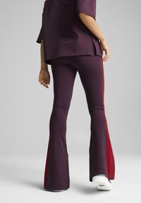 Puma PLAY.PARIS. FLARED - Nadrágok - midnight plum