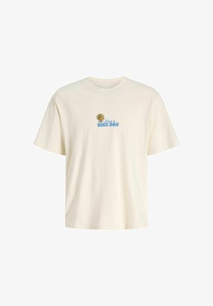 Kremfarvet kortærmet t-shirt med en lille smilende sol og blå tekst med teksten "Have a NICE DAY" centreret på brystet.