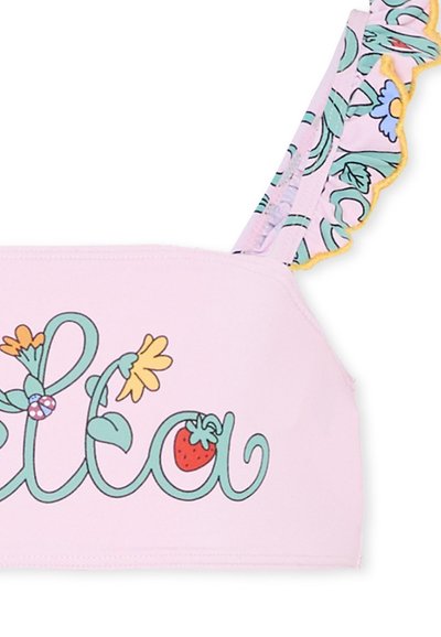 Top corto rosa con disegni floreali e dettagli a forma di fragola. Presenta spalline arricciate e una texture liscia, ideale per l'uso estivo.