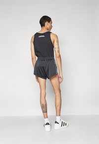 adidas Originals PRIDE TREFOIL - Tréningruha alsók - black