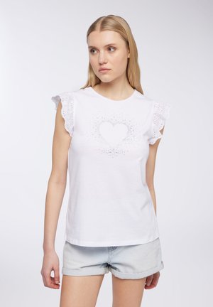 T-shirt bianco in cotone con maniche corte in pizzo, caratterizzato da un design a forma di cuore realizzato con piccole strass al centro.
