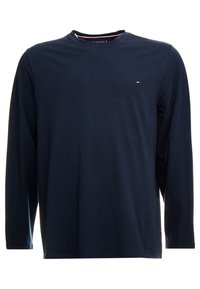 Granatowa koszulka z długim rękawem, wykonana z bawełny, z dekoltem typu crew i minimalnym logo na piersi. Miękka struktura z luźnym krojem.