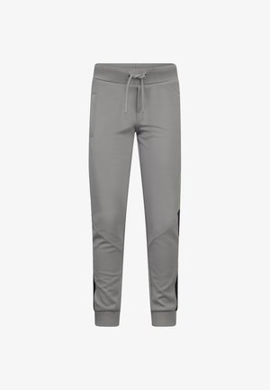 Grijze sportbroek van lichtgewicht stof, met een elastische tailleband met trekkoord, zijzakken en zwarte en groene accenten aan de zijkanten.