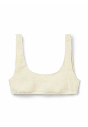 Sostén crema de tono claro hecho de tela texturizada con escote cuadrado y tirantes anchos, que presenta un diseño simple y minimalista.