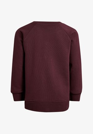 Maroonski dukserica izrađena od teksturiranog materijala, s dugim raglan rukavima, okruglim izrezom i rebrastim rubom i manžetama.
