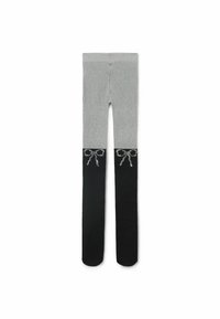Grå og sorte leggings med tætsiddende pasform. Den øverste halvdel er grå, mens den nederste halvdel er helt sort med dekorative bueaccentuer i sølv.