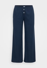 Námořnické široké kalhoty s textura designem, mají stahovací pás a dva kulaté stříbrné knoflíky vpředu.