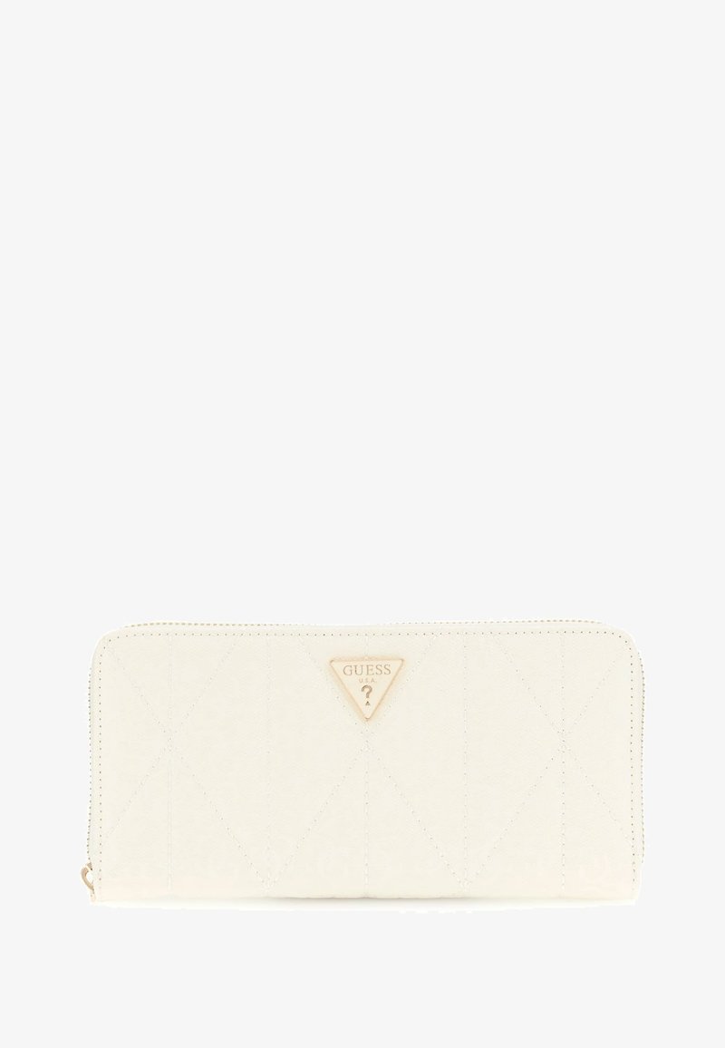 White quilted wallet made of synthetic material featuring a gold Guess logo triangle. Zipper closure and subtle stitching details enhance design.