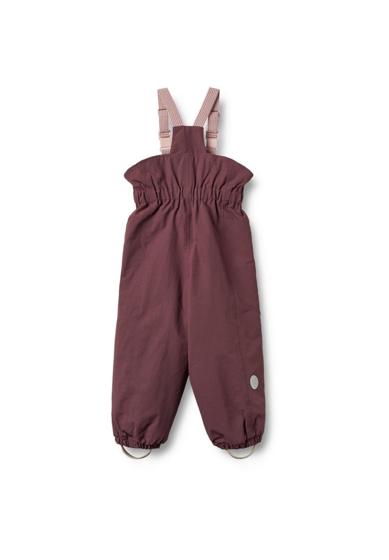 Bordeauxfarbene wasserdichte Latzhose mit elastischem Bund und verstellbaren Trägern. Verfügt über Metallösen am Saum und einem runden grauen Logo-Patch.