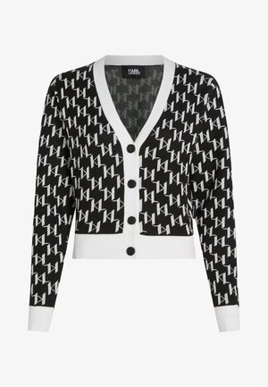 Juodos ir baltos spalvų raštų kardiganas su V formos iškirpte, sutrauktu apvadu ir ilgomis rankovėmis. Savybės: juodi mygtukai ir kontrastingas baltas apvadas.