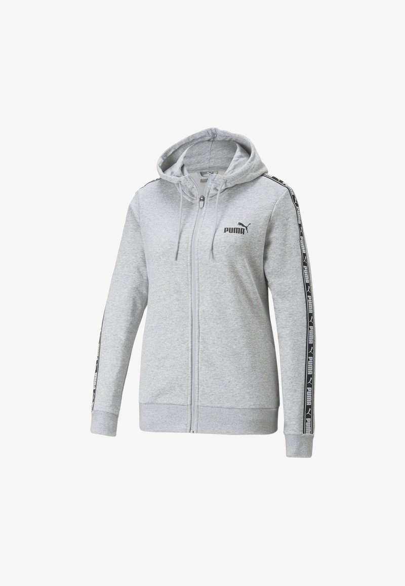 Sweat à capuche gris clair avec fermeture éclair, poches avant, capuche ajustable, logo Puma noir sur la poitrine et bandes marquées le long des manches.