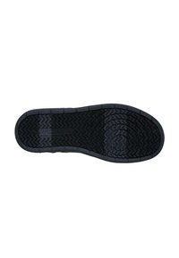 Suela de zapato de goma negra con un patrón de banda de rodadura en zigzag, que presenta superficies texturizadas y bordes definidos para mejorar el agarre y la durabilidad.