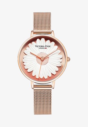 Runder roségoldener Uhr mit einem strukturierten weißen Gänseblümchen-Design auf einem farbverlaufenden rosafarbenen Zifferblatt. Das Netzarmband verleiht einen eleganten Abschluss.