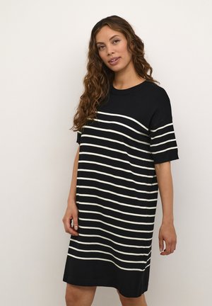 Black and white striped dress with short sleeves, round neckline, and relaxed fit. Fabric appears soft with a knit texture.