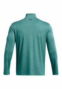 Długorękawowa koszulka sportowa w kolorze teal z geometrycznym wzorem, z wysokim kołnierzem i logo UA na plecach. Wykonana z miękkiego, elastycznego materiału.