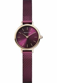 Bering watch with a round gold case, deep purple gradient dial, gold hour markers, and a textured purple mesh strap.