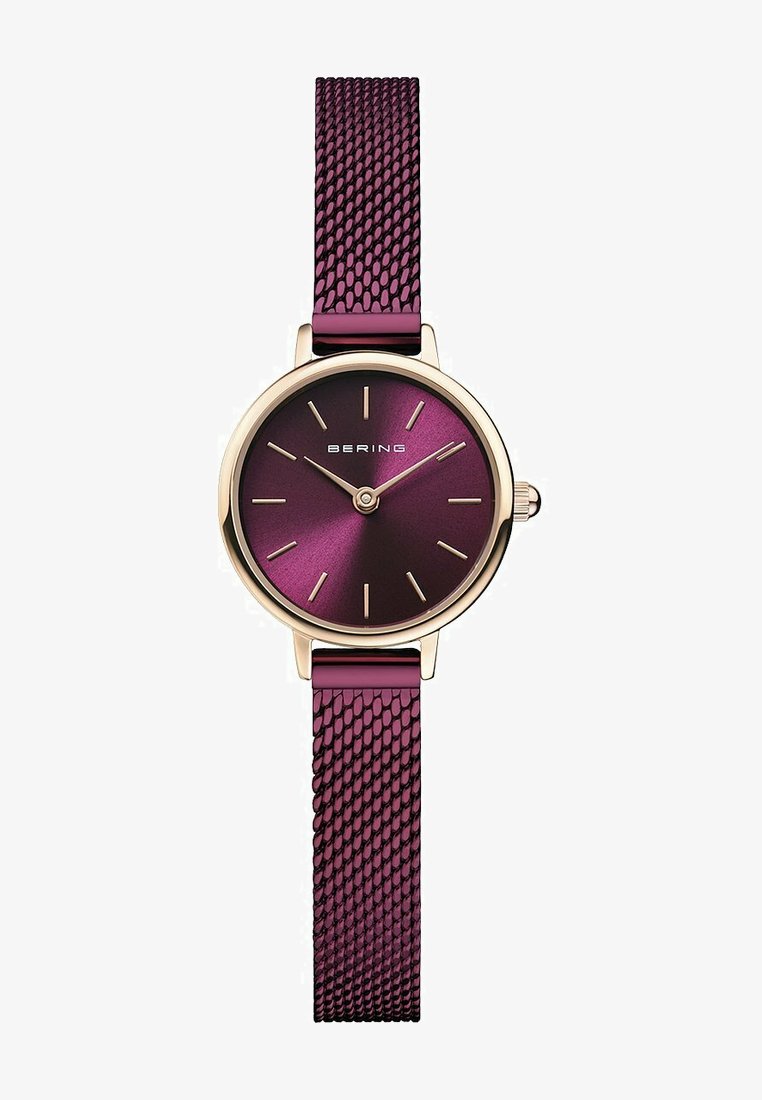 Bering-Uhr mit rundem goldenen Gehäuse, Zifferblatt mit tiefem lila Farbverlauf, goldenen Stundenmarkierungen und einem strukturierten lila Mesh-Armband.