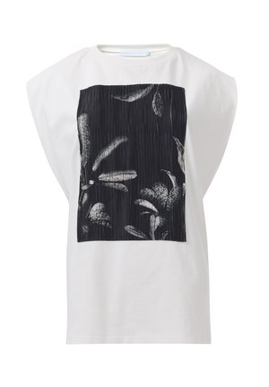 White oversized t-shirt with a black and white floral print panel featuring vertical lines, round neckline, and short sleeves.