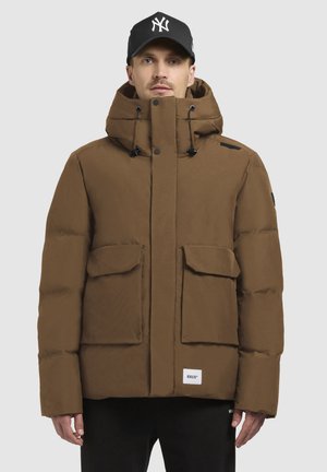 Brown puffer jacket with a high collar, two large front pockets, and adjustable drawstring hood. Smooth texture and logo detail at hem.